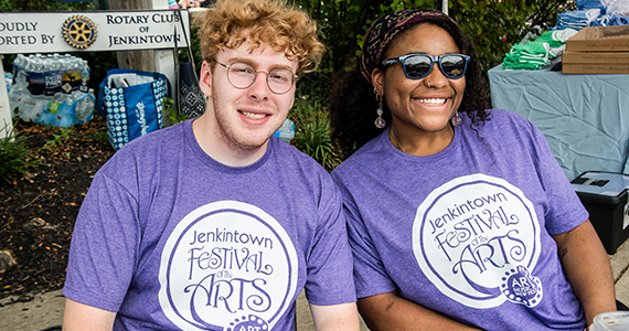 Two volunteers at a festival.